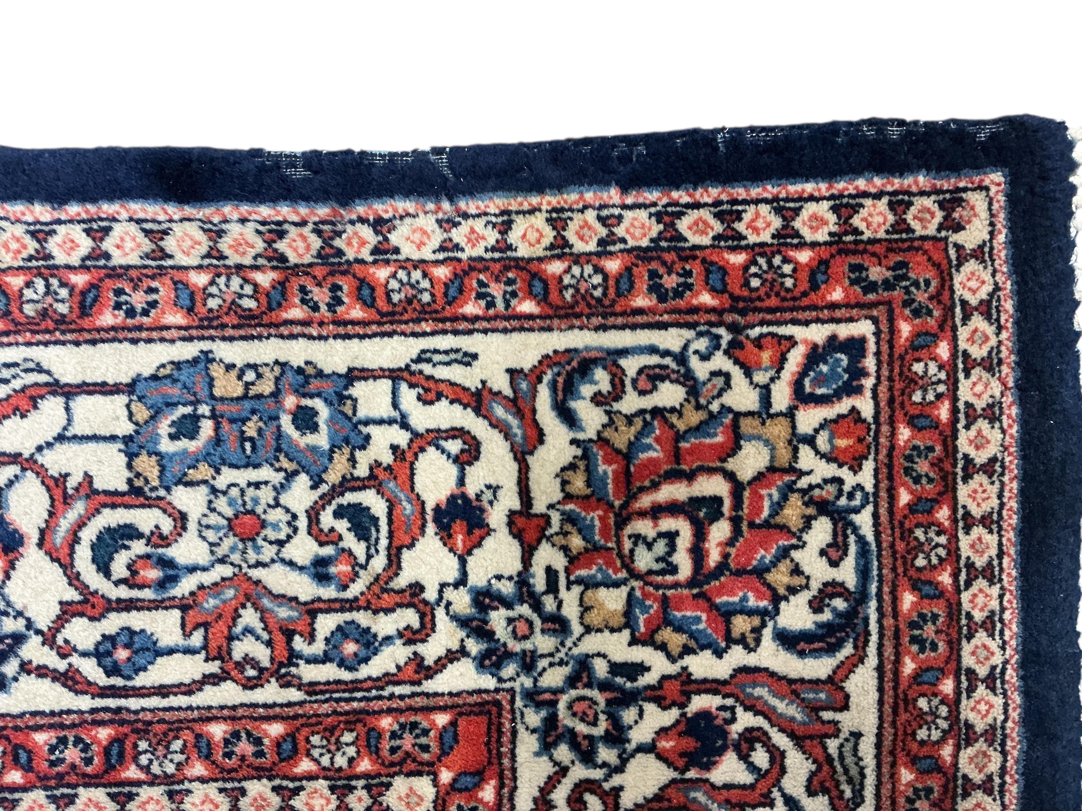 A Sarouk blue ground carpet, 320 x 210cm